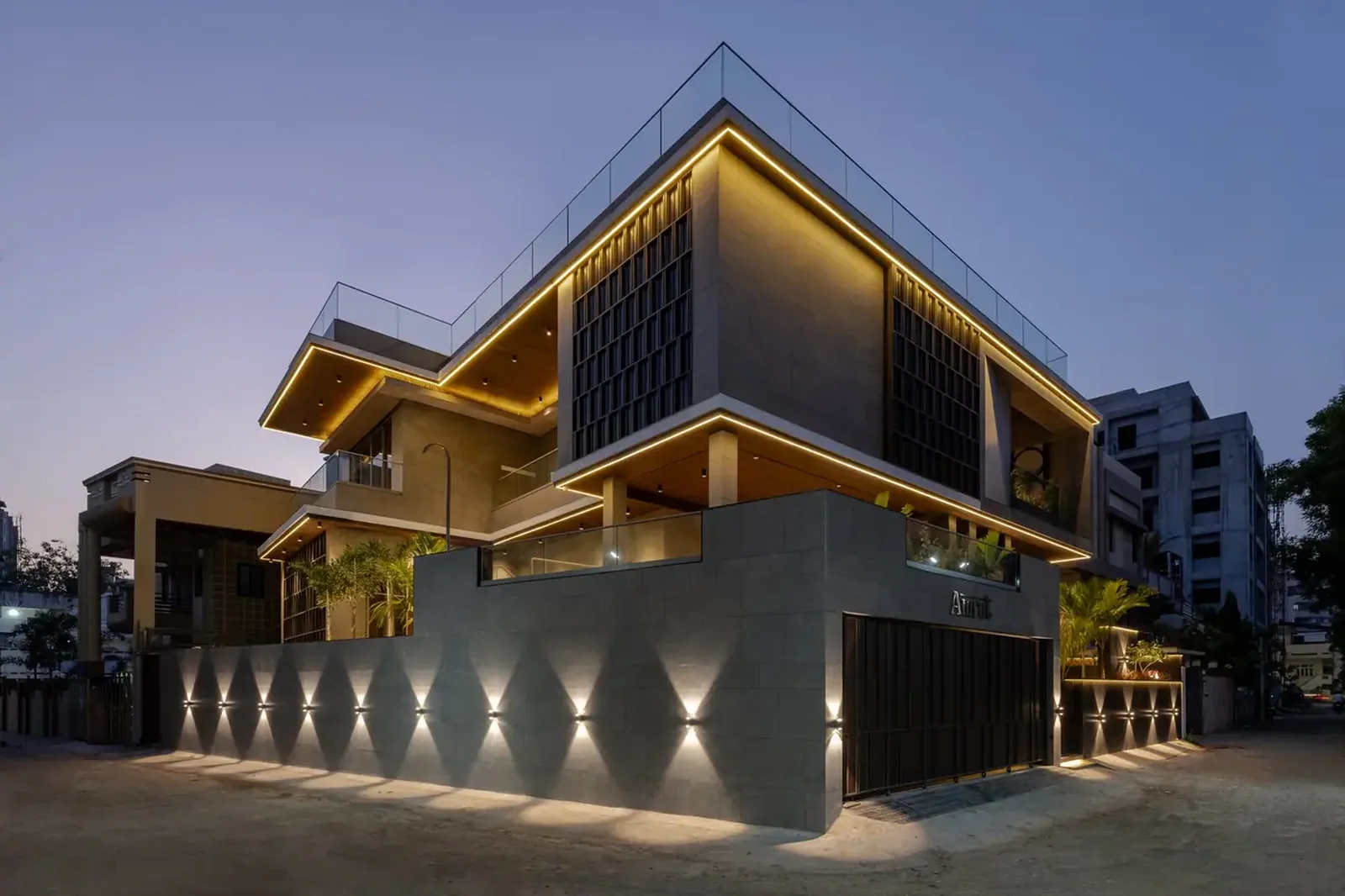 Amrut-Ujjwal Bhai residence — exterior at dusk, Navsari